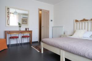 A bed or beds in a room at Affittacamere La Piazzetta