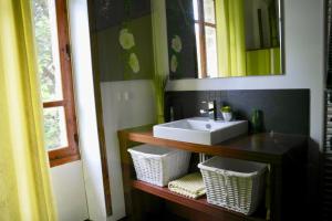 a bathroom with a sink and a mirror at 700m de la plage des Dames - Maison pour 9 in Noirmoutier-en-l'lle +26 photos