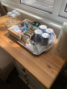 a tray of food and drinks on a table at Salamander Guest House in Stratford-upon-Avon