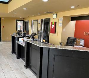 an empty lobby with a counter in a hospital at Motel 6 Oklahoma City OK Fairgrounds West in Oklahoma City +35 photos