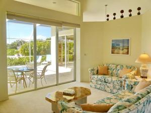 a living room with a couch and a table at 1411 Galleon Avenue in Marco Island