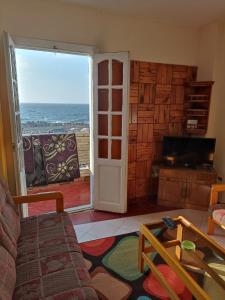 a living room with a view of the ocean at شقة مطلة على البحر 10 in Alexandria