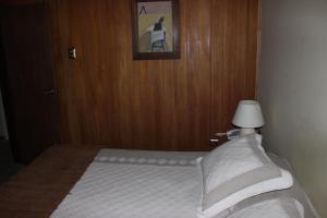 Postel nebo postele na pokoji v ubytování Hotel Seminario