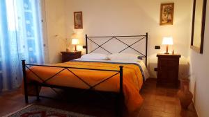 A bed or beds in a room at Agriturismo S. Apollinare