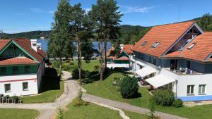 an aerial view of a house with red roof at Apartmán Kapy Lipno in Lipno nad Vltavou