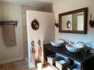 a bathroom with two sinks and a mirror at Reus, cosy apartment in the city's centre in Reus
