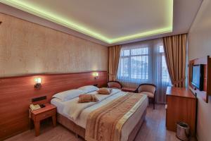 Ένα ή περισσότερα κρεβάτια σε δωμάτιο στο Seymen Hotel +69 φωτογραφίες