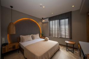 a bedroom with a large bed and a large window at Villa Siesta Hotel Istanbul Airport in Karaburun