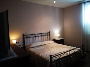 Postel nebo postele na pokoji v ubytování Il Rovo di More