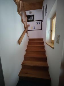 a stairway in a room with wooden stairs at Ferienwohnung Stricker in Obertraun