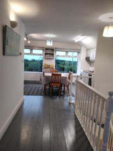 a kitchen and dining room with a table and a dining room at The Ramblings in Wexford