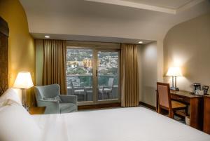 Posteľ alebo postele v izbe v ubytovaní Hotel Plaza Juan Carlos