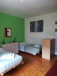 Postel nebo postele na pokoji v ubytování Donatella Apartment