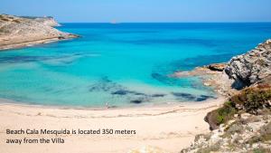 an aerial view of a beach in the ocean at Villa Cala Mesquida in Cala Mesquida
