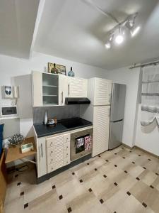 A cozinha ou cozinha compacta de Celeste Apartment