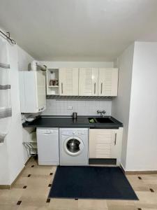 A cozinha ou cozinha compacta de Celeste Apartment