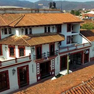 an overhead view of a building with red tile roofs at Hotel Catedral in San Cristóbal de Las Casas