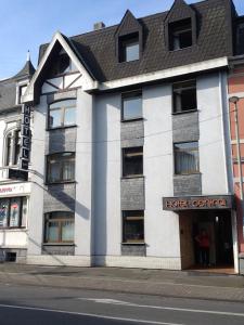 a hotel central building on the corner of a street at Hotel Central in Menden