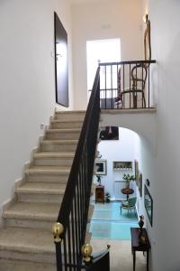 a staircase in a house with a blue floor at Bed and Breakfast Oz in Bari