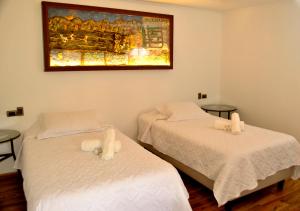 Postel nebo postele na pokoji v ubytování Hotel Boutique Casona Violeta