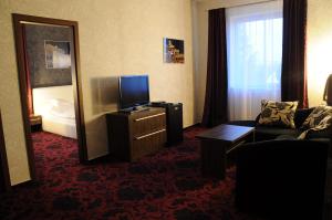 TV a/nebo společenská místnost v ubytování Restaurace a hotel Amerika