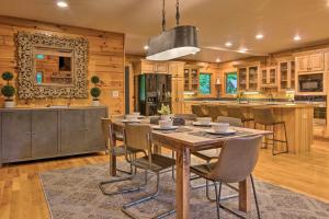 a kitchen with a table and chairs in a room at 7 Mi to Ski Slopes Mars Hill Cabin with Hot Tub! in Mars Hill