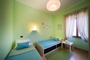 Posteľ alebo postele v izbe v ubytovaní Casina Pian Di Monetto