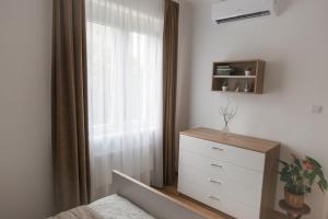 Posteľ alebo postele v izbe v ubytovaní BohoHome Apartment Eger