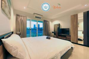 TV a/nebo společenská místnost v ubytování Nalanta Hotel Pattaya