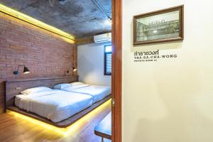 Postel nebo postele na pokoji v ubytování Siam Plug In Hostel