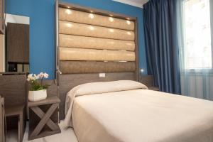 Posteľ alebo postele v izbe v ubytovaní Hotel Marconi Express
