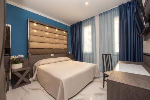 Säng eller sängar i ett rum på Hotel Marconi Express