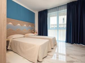 Posteľ alebo postele v izbe v ubytovaní Hotel Marconi Express