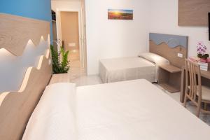 Posteľ alebo postele v izbe v ubytovaní Hotel Marconi Express