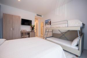 Posteľ alebo postele v izbe v ubytovaní Hotel Marconi Express