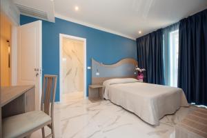 Posteľ alebo postele v izbe v ubytovaní Hotel Marconi Express