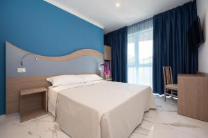 Posteľ alebo postele v izbe v ubytovaní Hotel Marconi Express