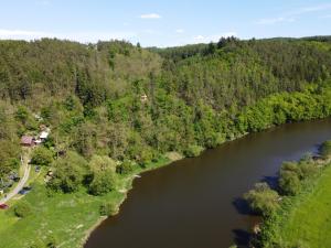 an aerial view of a river with trees at Bouda Orlí Hnízdo in Němčovice