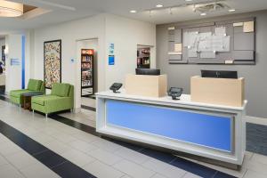 a waiting area in a store with chairs and a counter at Holiday Inn Express - Tullahoma, an IHG Hotel in Tullahoma
