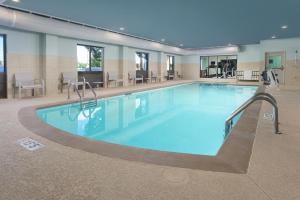 a large swimming pool in a building at Holiday Inn Express - Tullahoma by IHG in Tullahoma