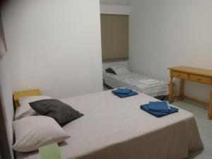 Posteľ alebo postele v izbe v ubytovaní TRIANA PUREZA 12-14