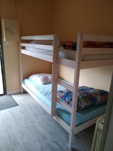 a bedroom with two bunk beds in a room at Marie in Aytré