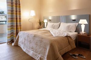 Rúm í herbergi á Hotel Eden Roc - The Leading Hotels of the World