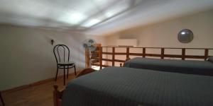 A bed or beds in a room at Villetta Romeo Casavacanze