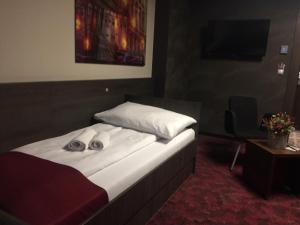 Postel nebo postele na pokoji v ubytování Kongres Hotel Roca