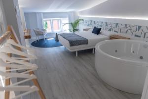 A bed or beds in a room at APARTAMENTOS CUME DO PINDO