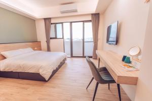 Postel nebo postele na pokoji v ubytování The Pai Hotel