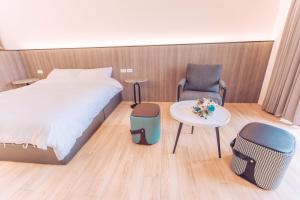 Postel nebo postele na pokoji v ubytování The Pai Hotel