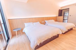 Postel nebo postele na pokoji v ubytování The Pai Hotel