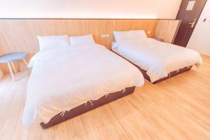 Postel nebo postele na pokoji v ubytování The Pai Hotel